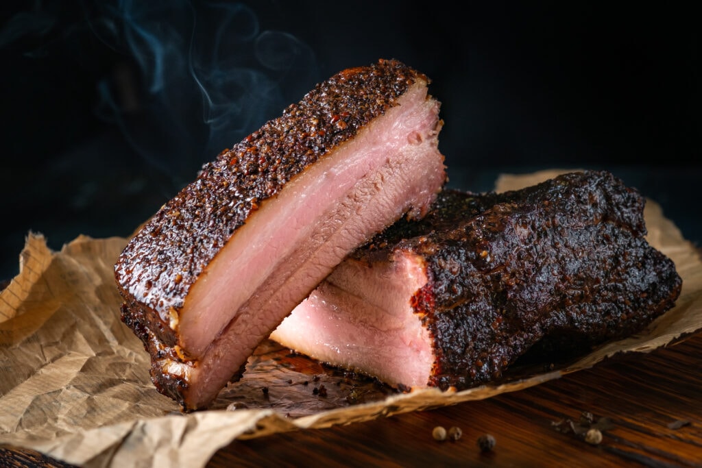 Sliced smoked brisket with pink smoke ring